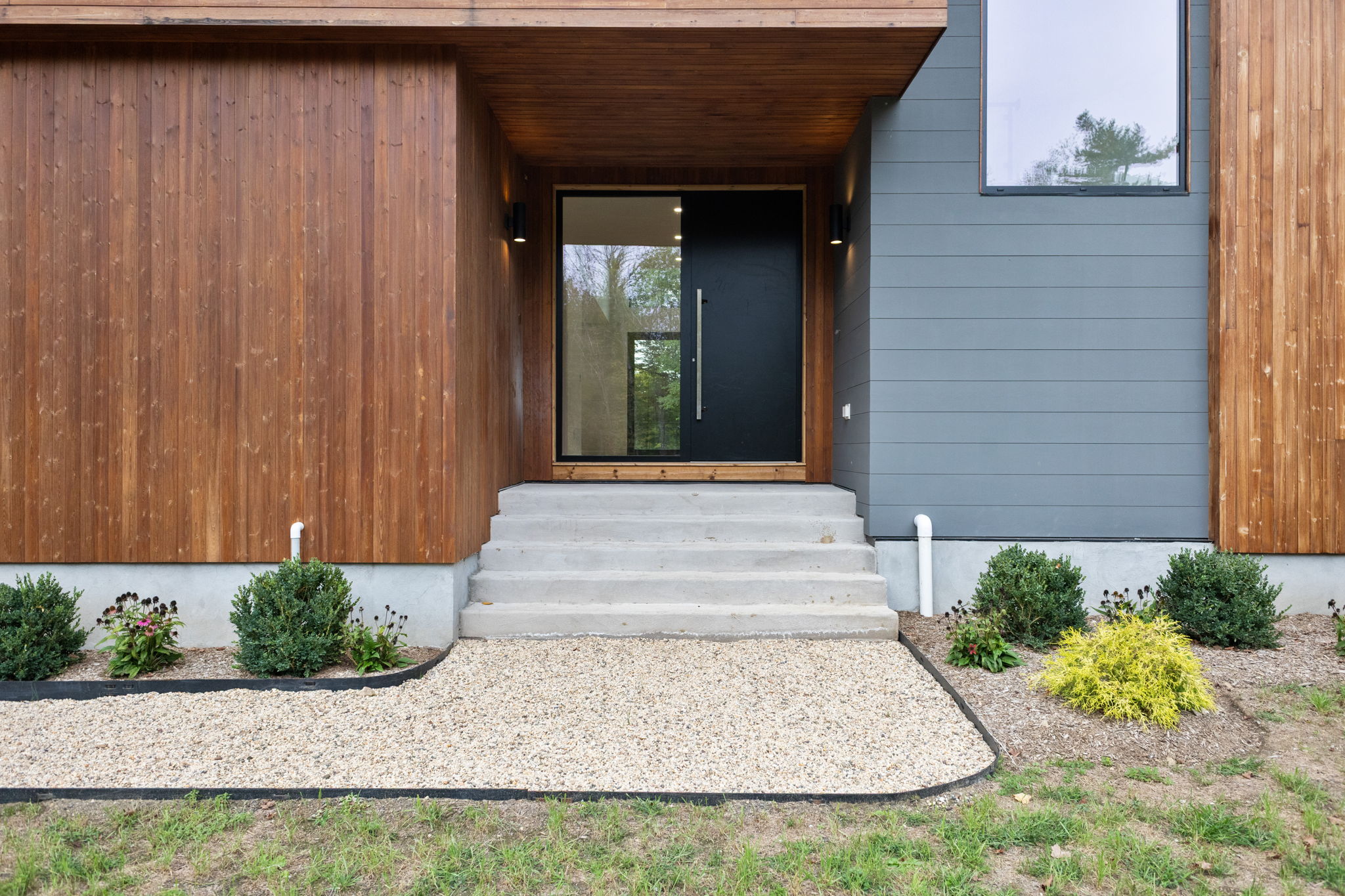 The cedar-clad front entry of a CG Homes residence at East Lane, Armonk, NY