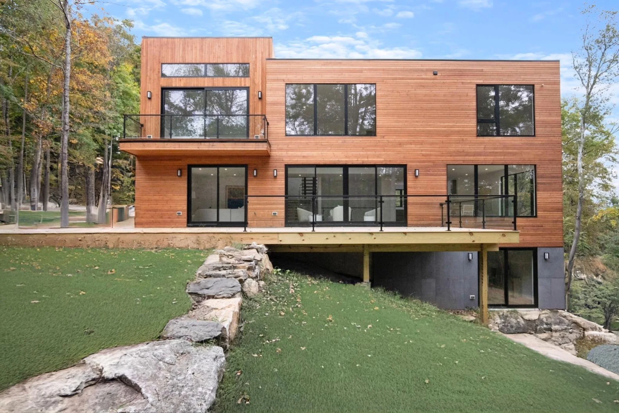 Old Roaring Brook, Chappaqua, NY: exterior of a completed CG Homes residence among mature trees